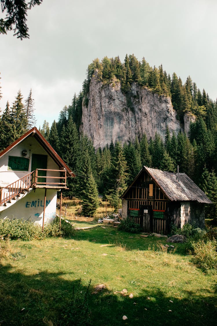 Cabin And Shed In Mountain Valley