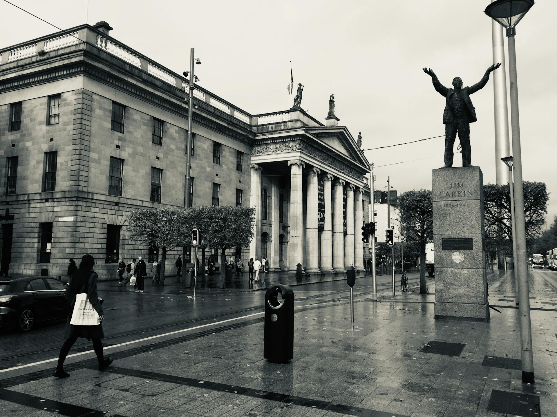 Black and white photo of the Jim Larkin Statue and General Post Office, Dublin.