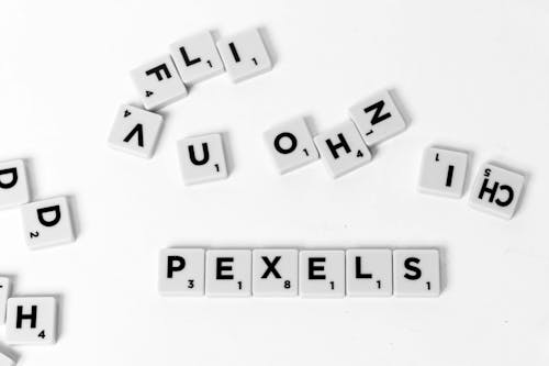 White and Black Scrabble Tiles in Close Up Shot