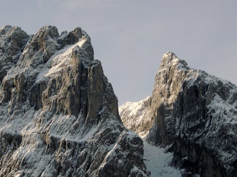 Stunning snowy mountain peaks in Tyrol, Austria, captured on a clear winter day.