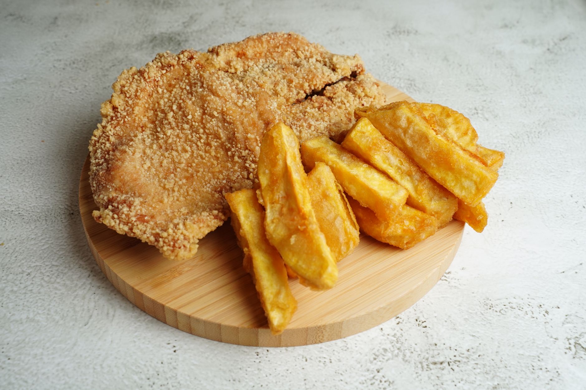 Reheated fried chicken on baking rack, crispy and golden
