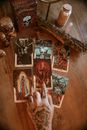 Faceless tattooed fortune teller pointing at tarot card