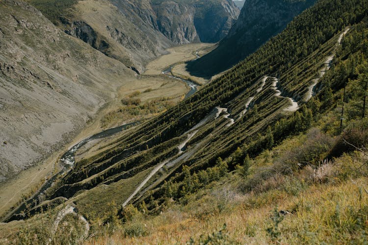 Narrow Stream Between Mountain Slopes