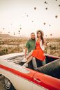 Loving couple having romantic date at Balloon Fest
