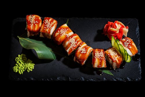 Free Close-Up Shot of Sushi on Black Plate Stock Photo