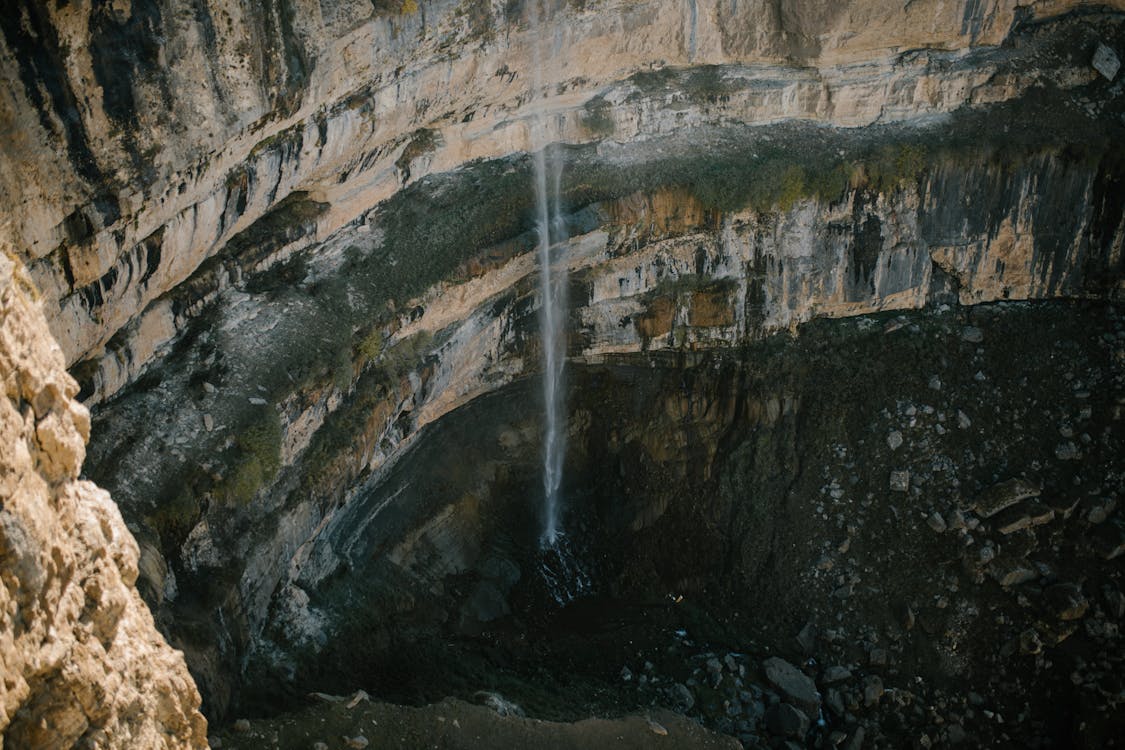 Water Falls W Rocky Cave