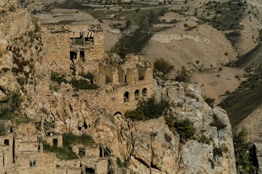 Explore these ancient ruins nestled in a rugged, eroded countryside landscape. Ideal for history enthusiasts.