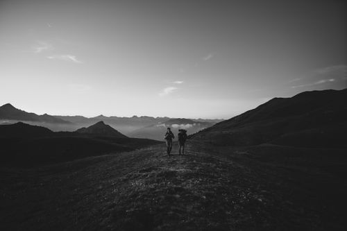 Free Two hikers enjoy a scenic adventure in the hills of Cesana Torinese, Piemonte. Stock Photo