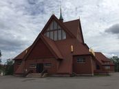 Brown Church Under Cloudy Sky