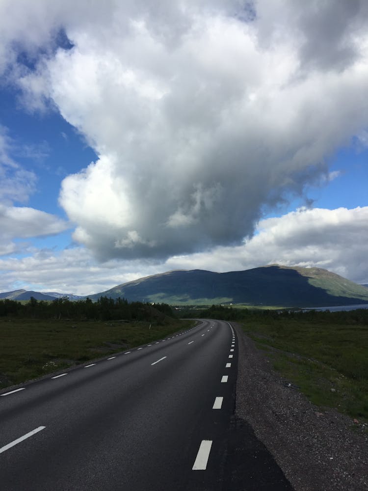 Clouds Hanging Low Over Asphalt Road