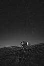 Grayscale Photo of House on Hill