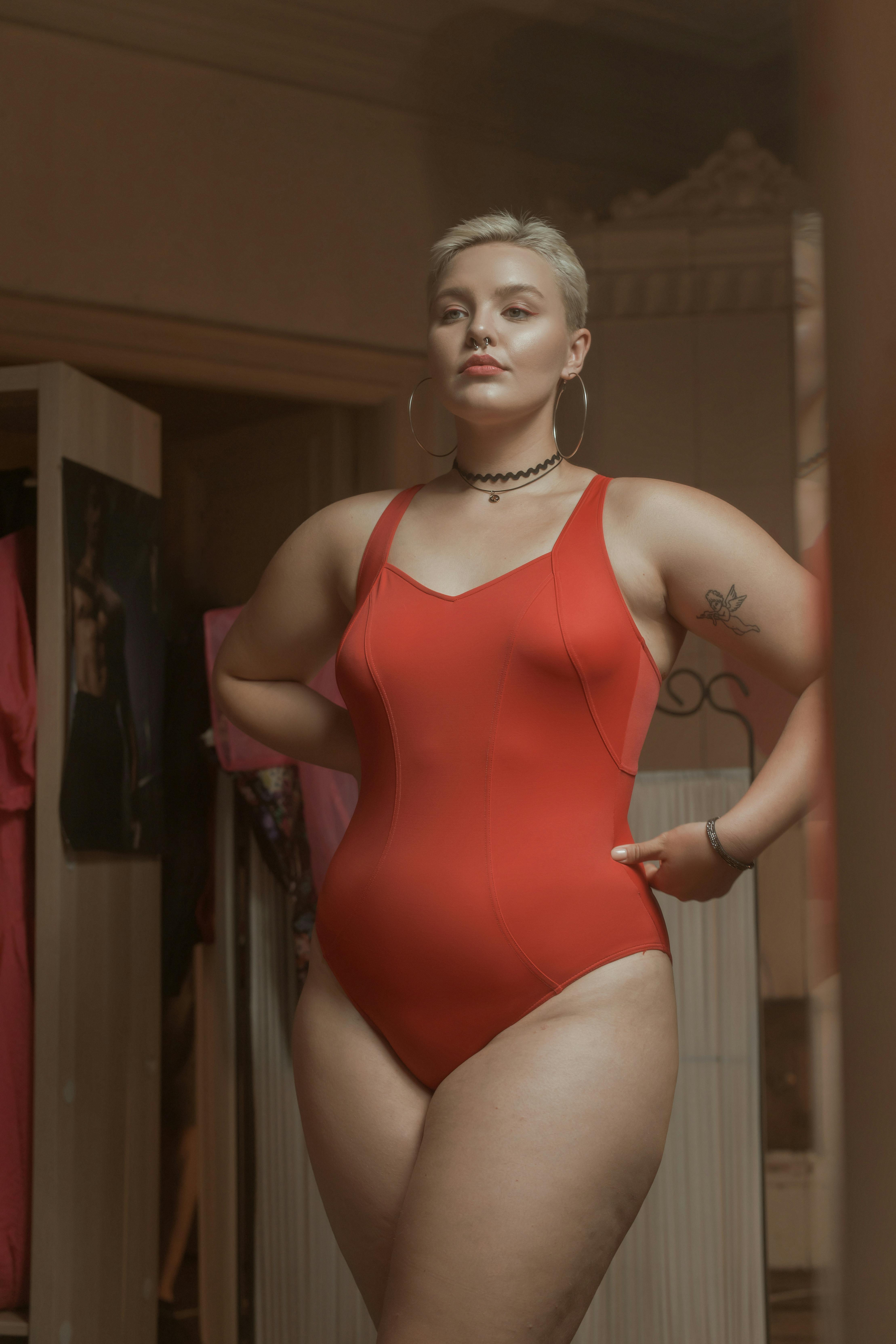 a woman wearing red bodysuit