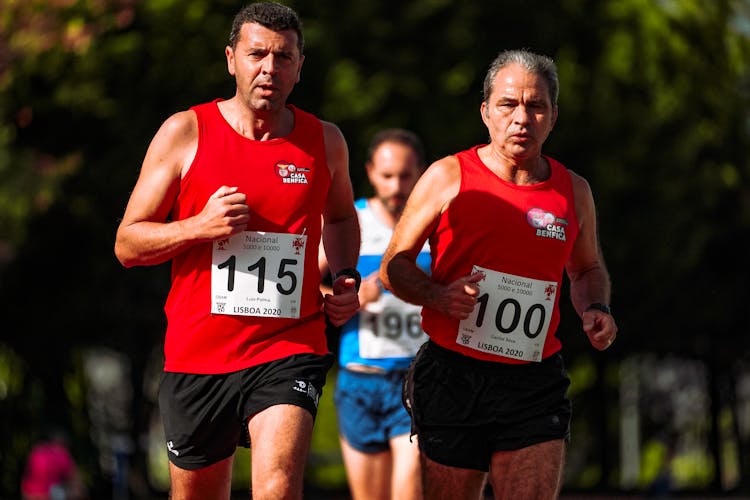 Middle Aged Sportsmen Running During Athletic Contest