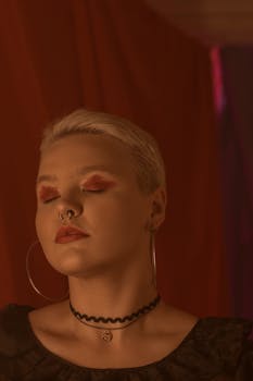 Captivating portrait of a woman with closed eyes, showcasing unique style and elegance.