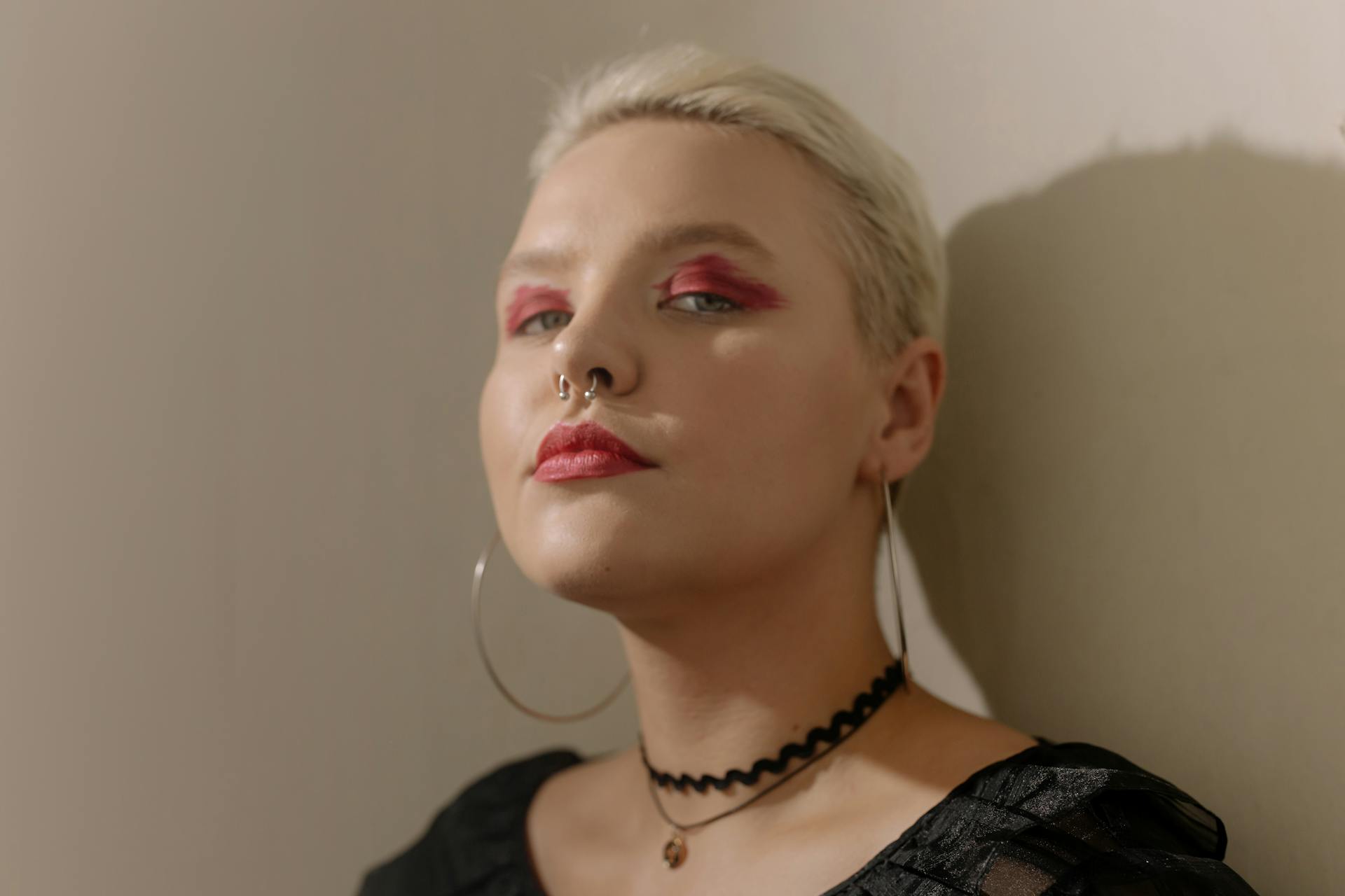 A Short Haired Woman Wearing a Choker