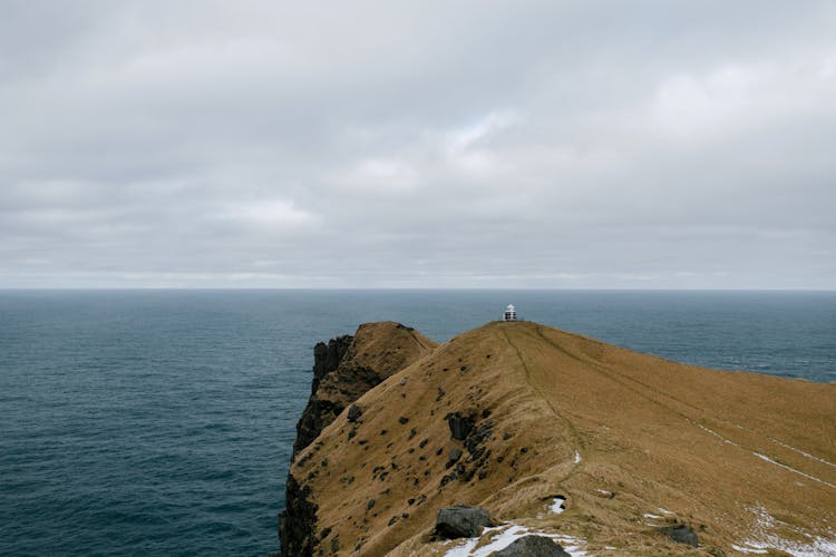 High Cliff With A Building On The Edge 