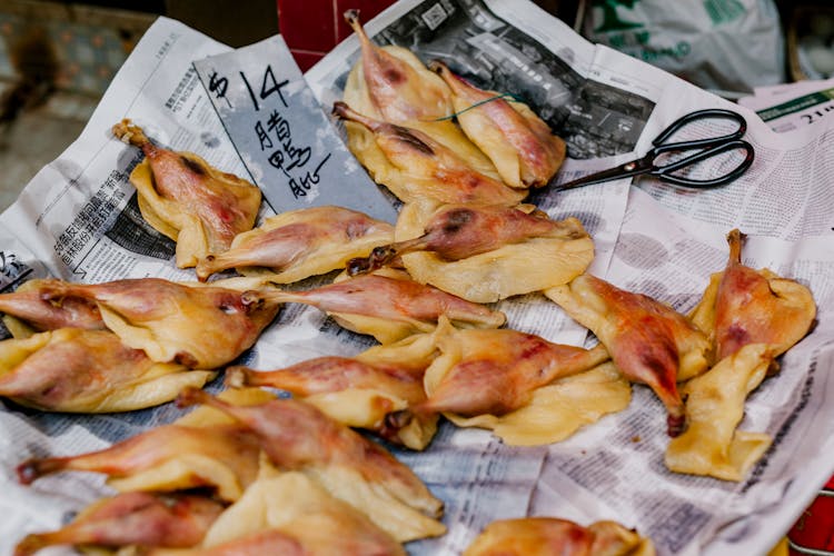 Dried Meat Placed On Newspapers