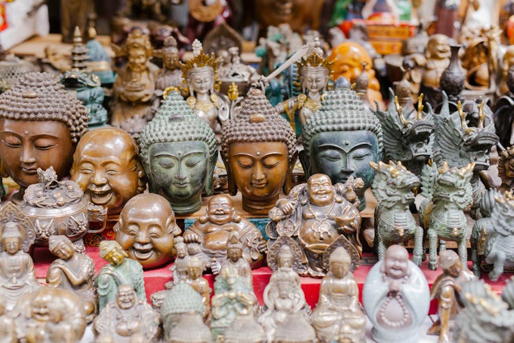 Selection Of Buddha Busts And Figurines