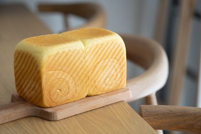 Artisan bread loaf on a wooden board — photo by Cats Coming on Pexels