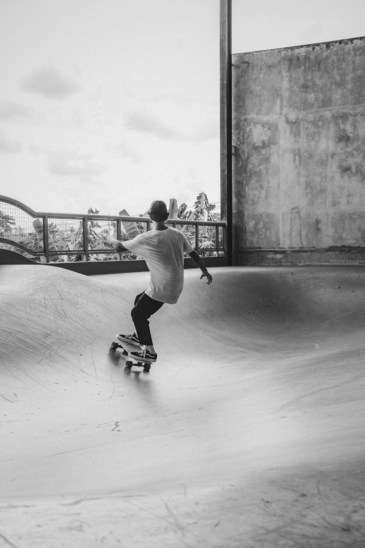 Guy Skating On Board In Skater Park