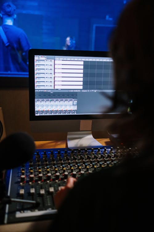 Man Using an Audio Mixing Equipment 