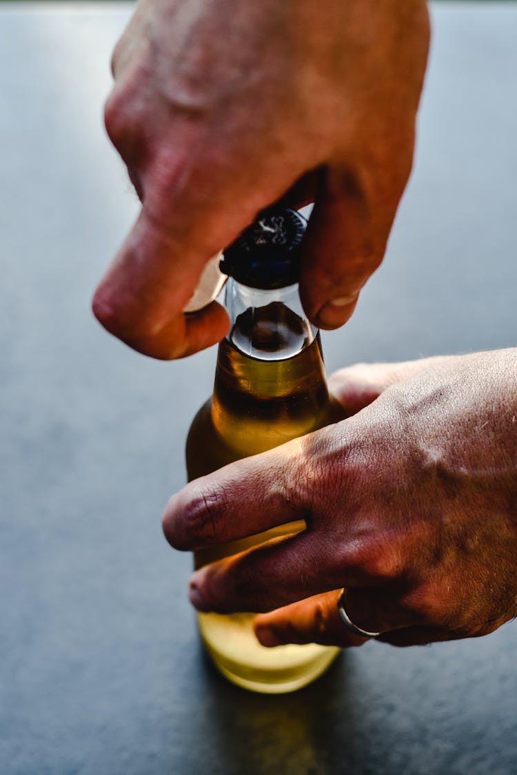 Person Opening A Beer