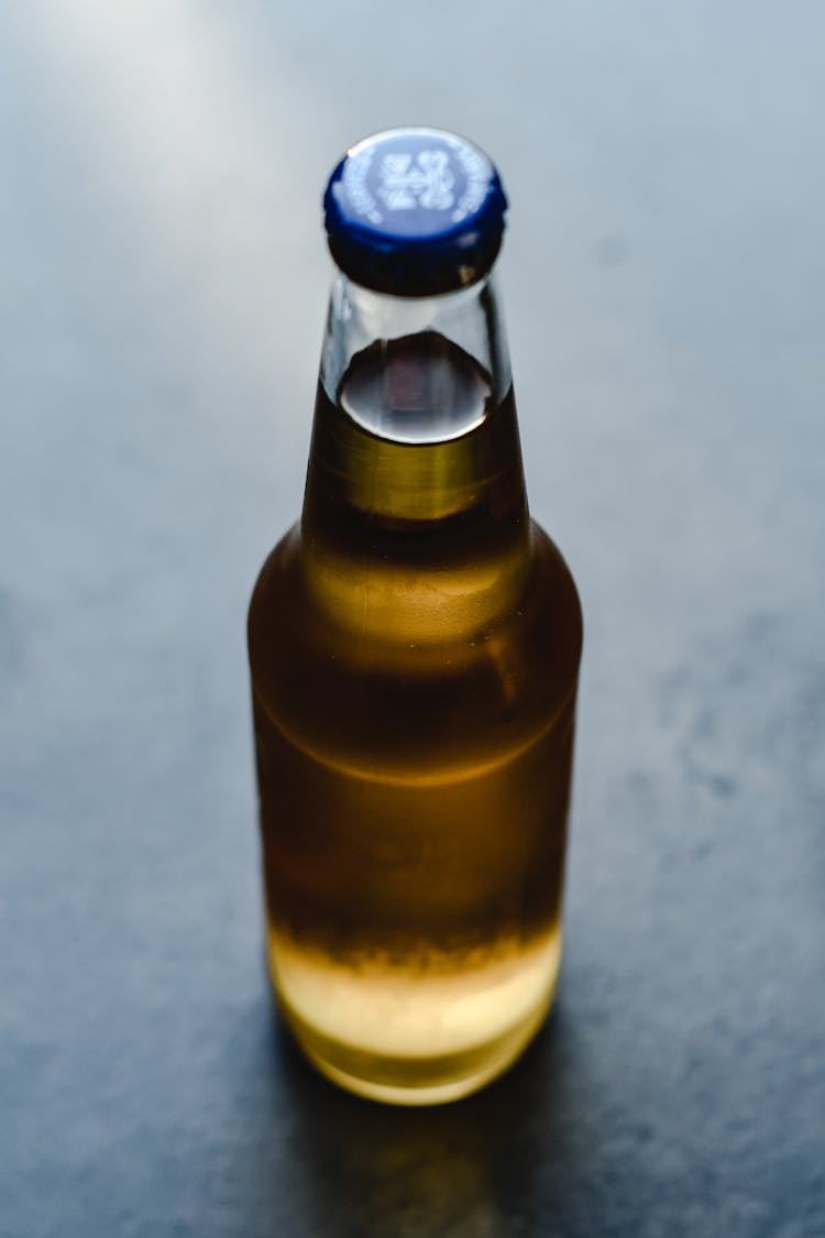 Close-Up Shot Of A Clear Bottle Of Beer