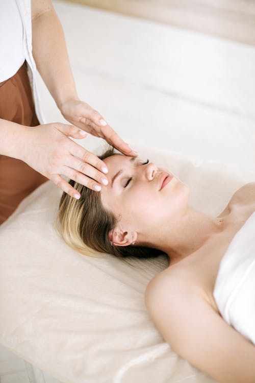 A Woman Getting a Face Massage