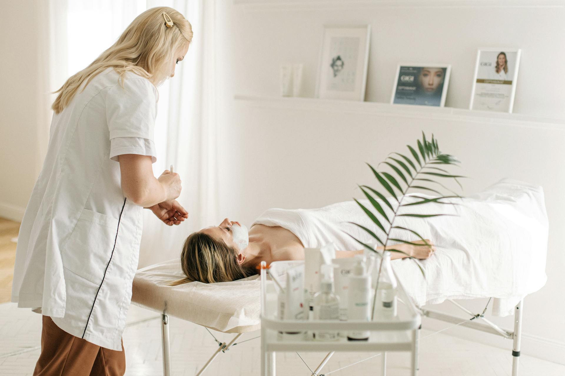 A Dermatologist Applying Facial Mask on Customer's Face