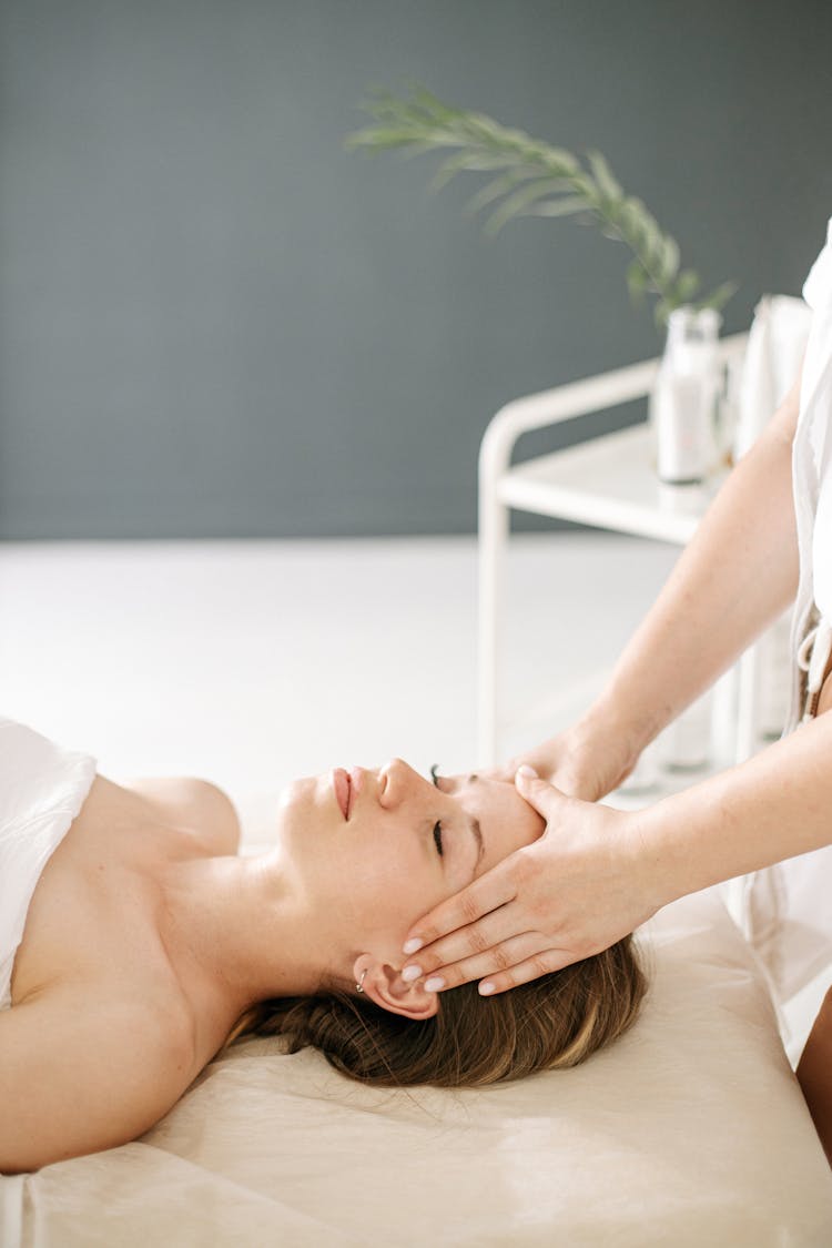 A Woman Getting A Face Massage