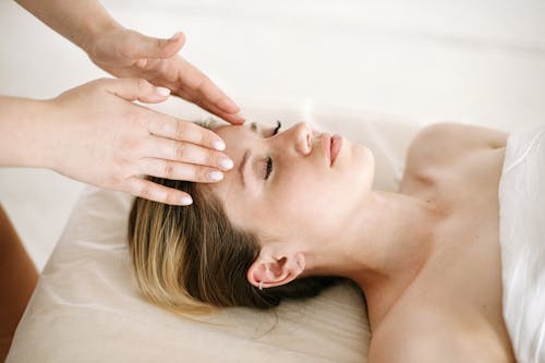 Free Woman Having a Face Massage Stock Photo