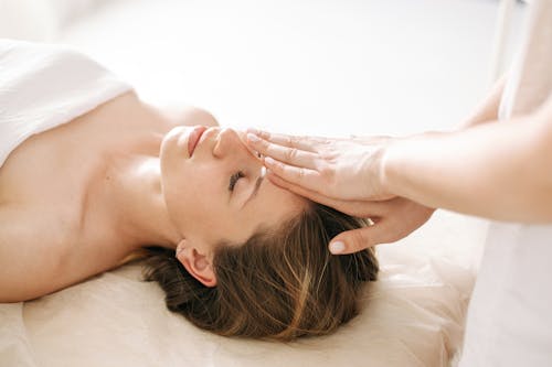 Free Woman Having a Face Massage Stock Photo