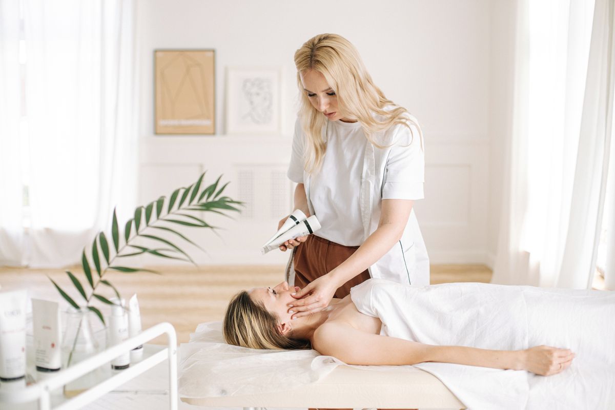 A skincare professional carrying out a personalized skin assessment