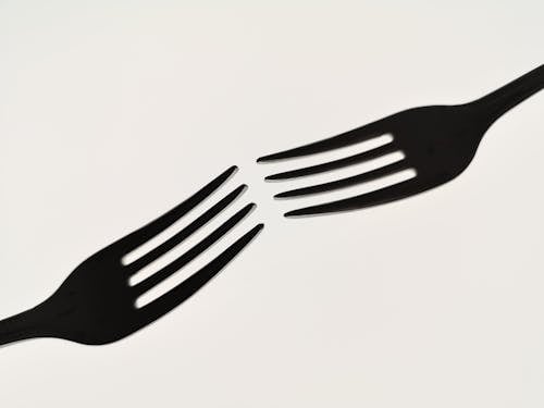 Close-up of Fork Shadow on Nude Background