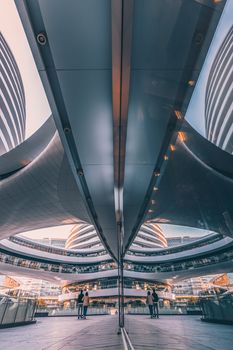 Explore the stunning futuristic design and mirror reflections at Beijing's Galaxy SOHO architectural landmark.