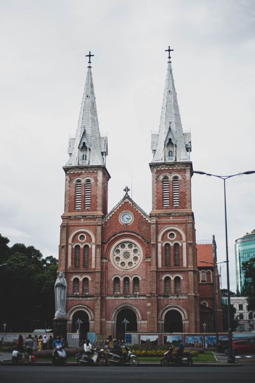 Free Notre-Dame Cathedral Basilica in Saigon with iconic twin towers. Stock Photo
