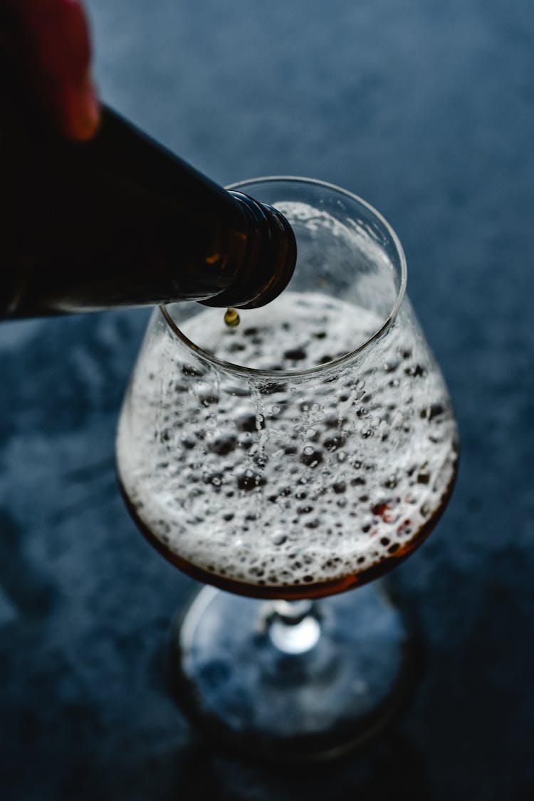 A Drop Of Beer On Bottle Rim