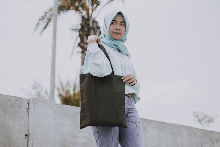 A Woman Carrying A Tote Bag 