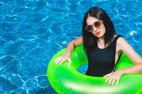 Woman in Green Pool Floater