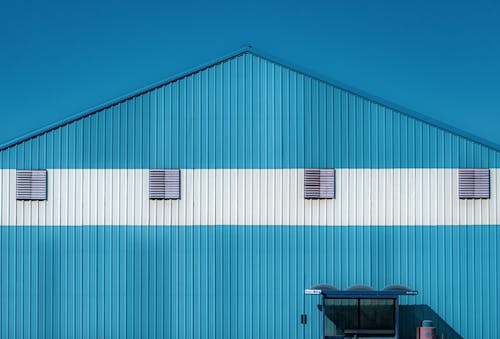 Building with Blue Corrugated Iron Sheets on Wall