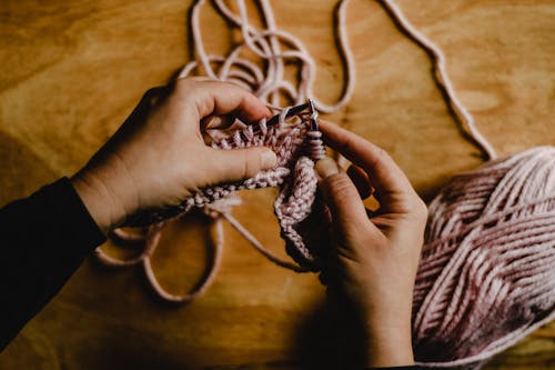 Close-Up of a Person Knitting 