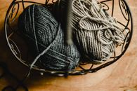 Black Yarn on Brown Wooden Table