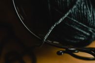 Black and White Rope on Brown Wooden Table