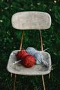 Red Yarn on Brown Wooden Chair