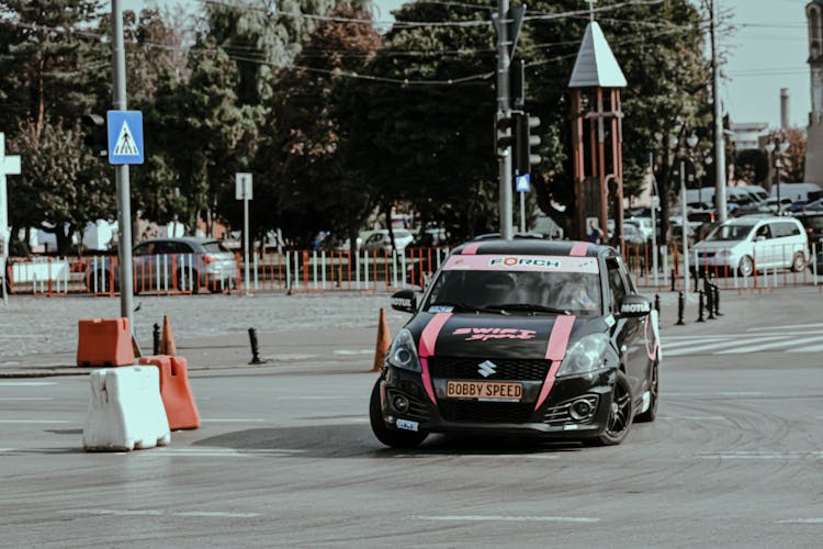 Racing Car On Central City Street