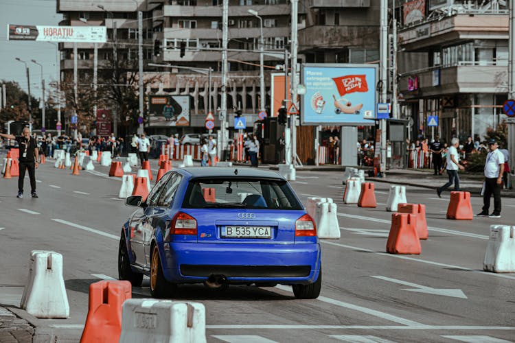 Racing Car On Busy Street