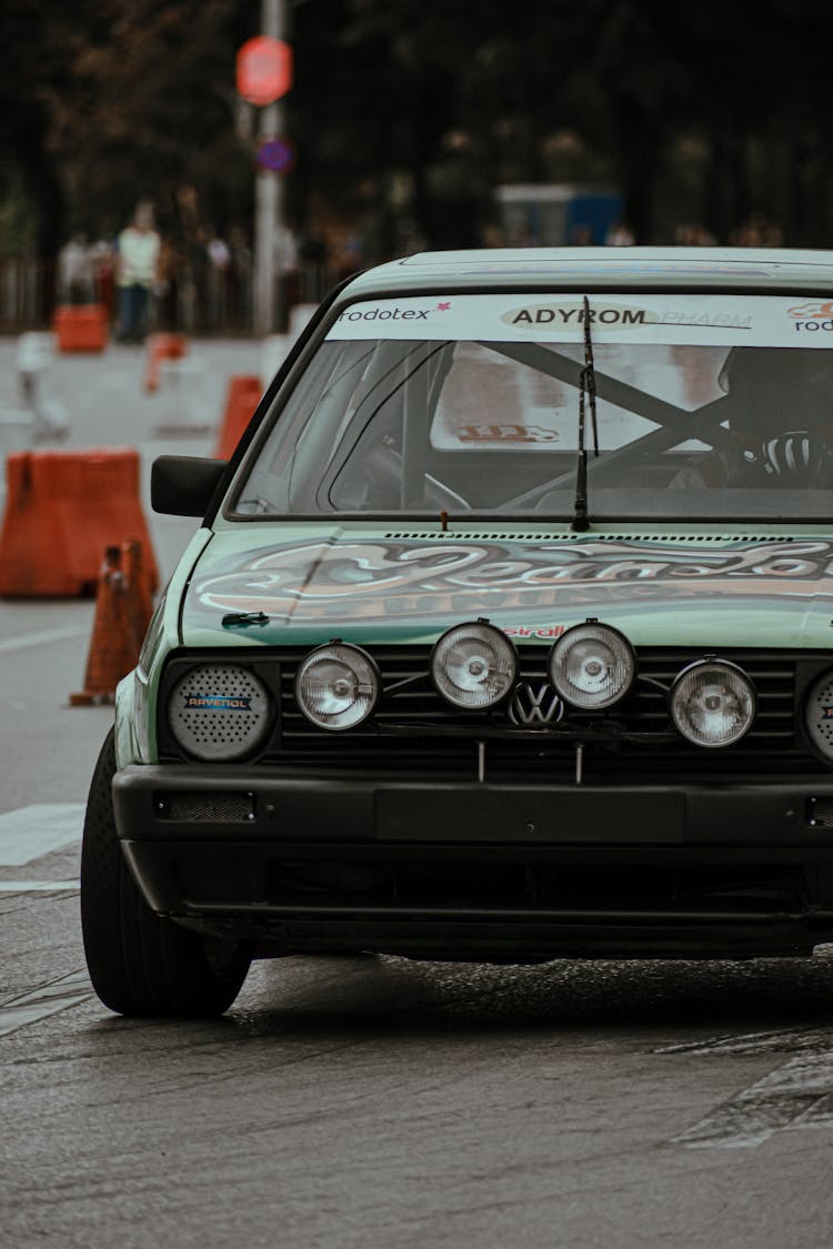 Old Fashioned Racing Car In City