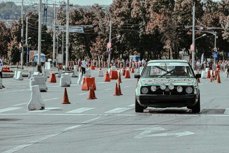 Old Car Racing On Empty Road