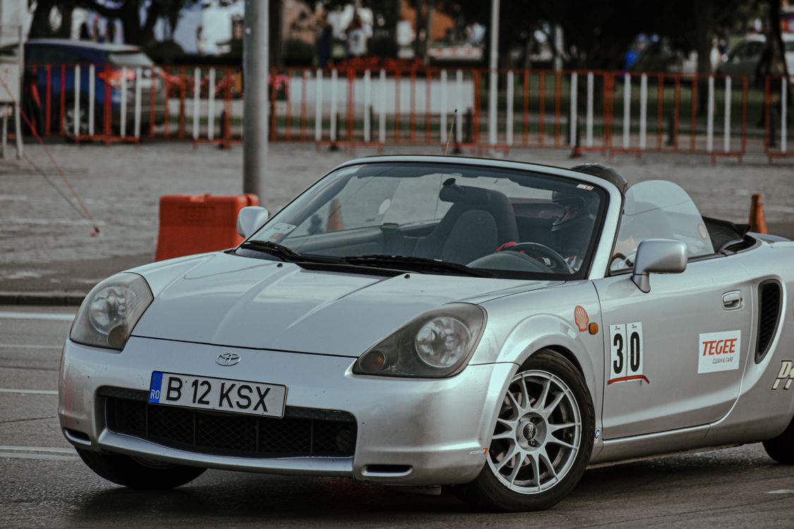 Convertible car racing in modern city · Free Stock Photo
