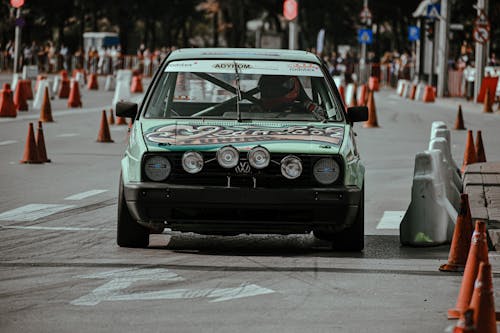 Retro car on road with cones